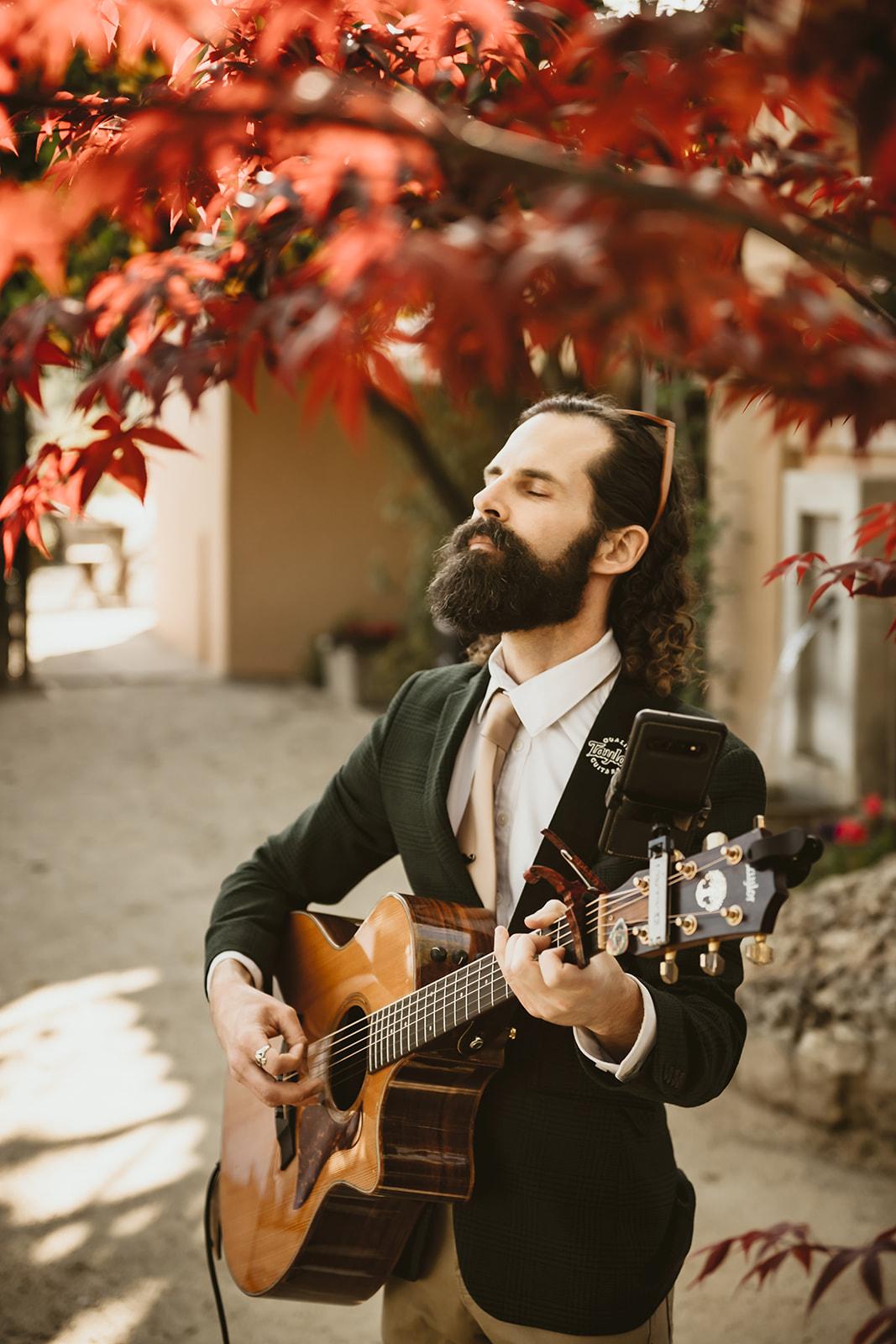 Brandon Bosch, playing guitar at Brindare, St Helena, CA