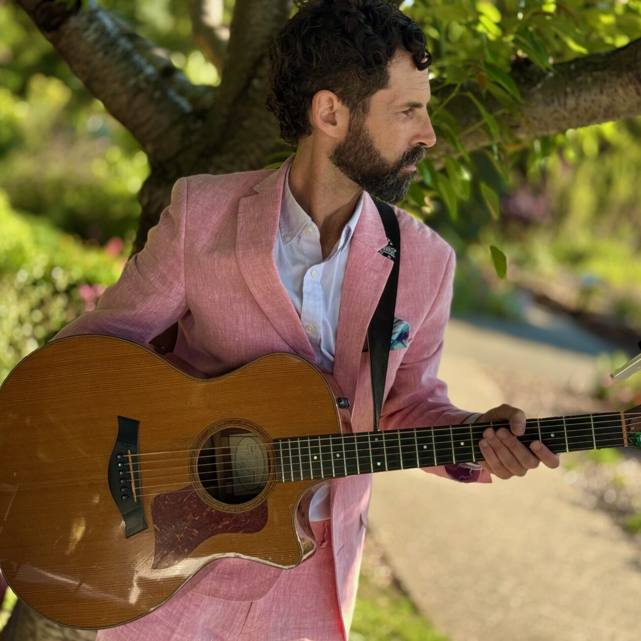 Corporate Event DJ with a Guitar in a pink suit in Walnut Creek